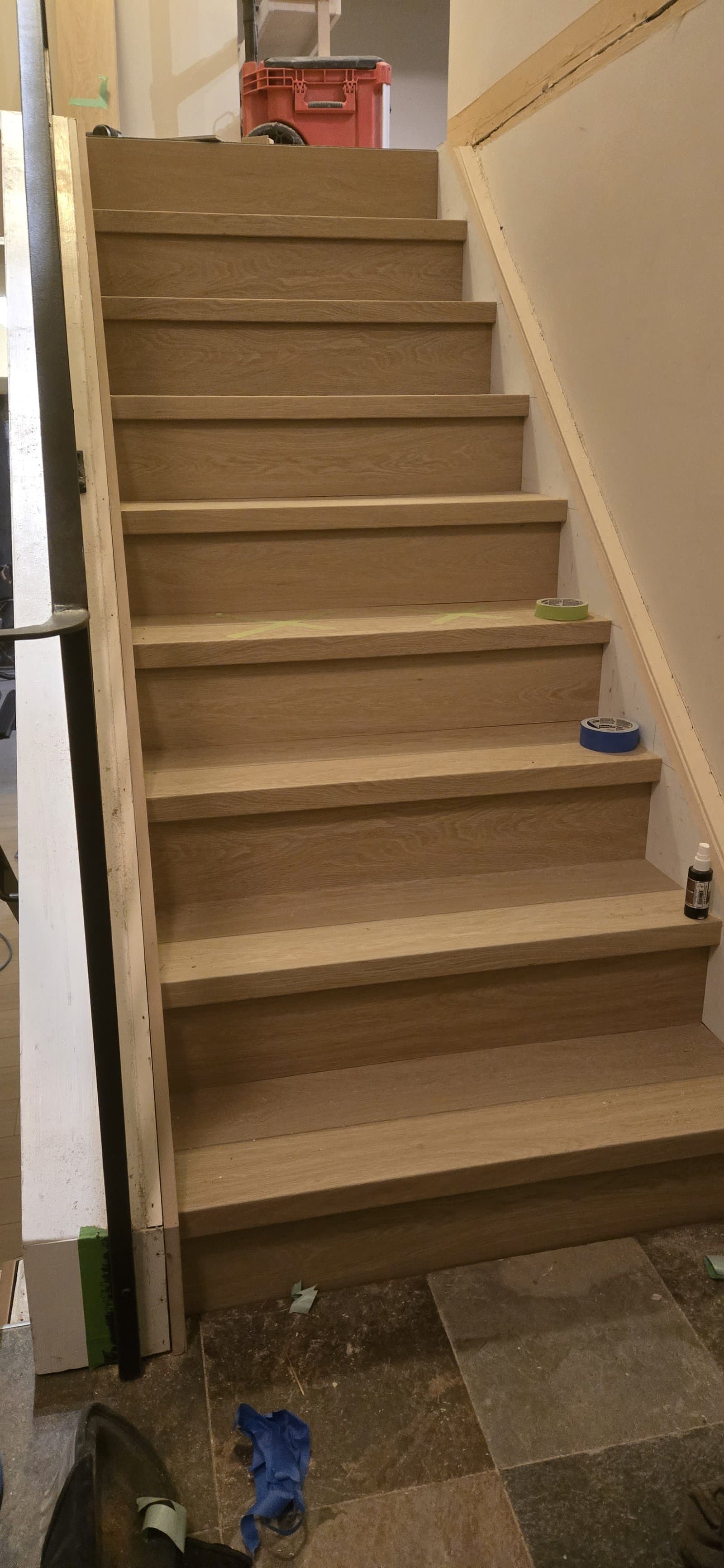 Finished oak stair treads viewed from above during install