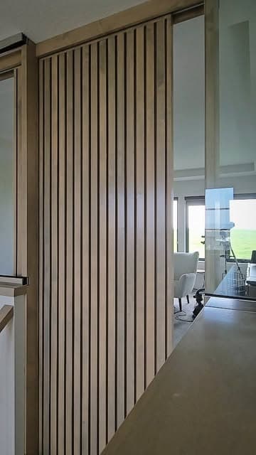 Custom maple sliding door on a soft-close aluminum track