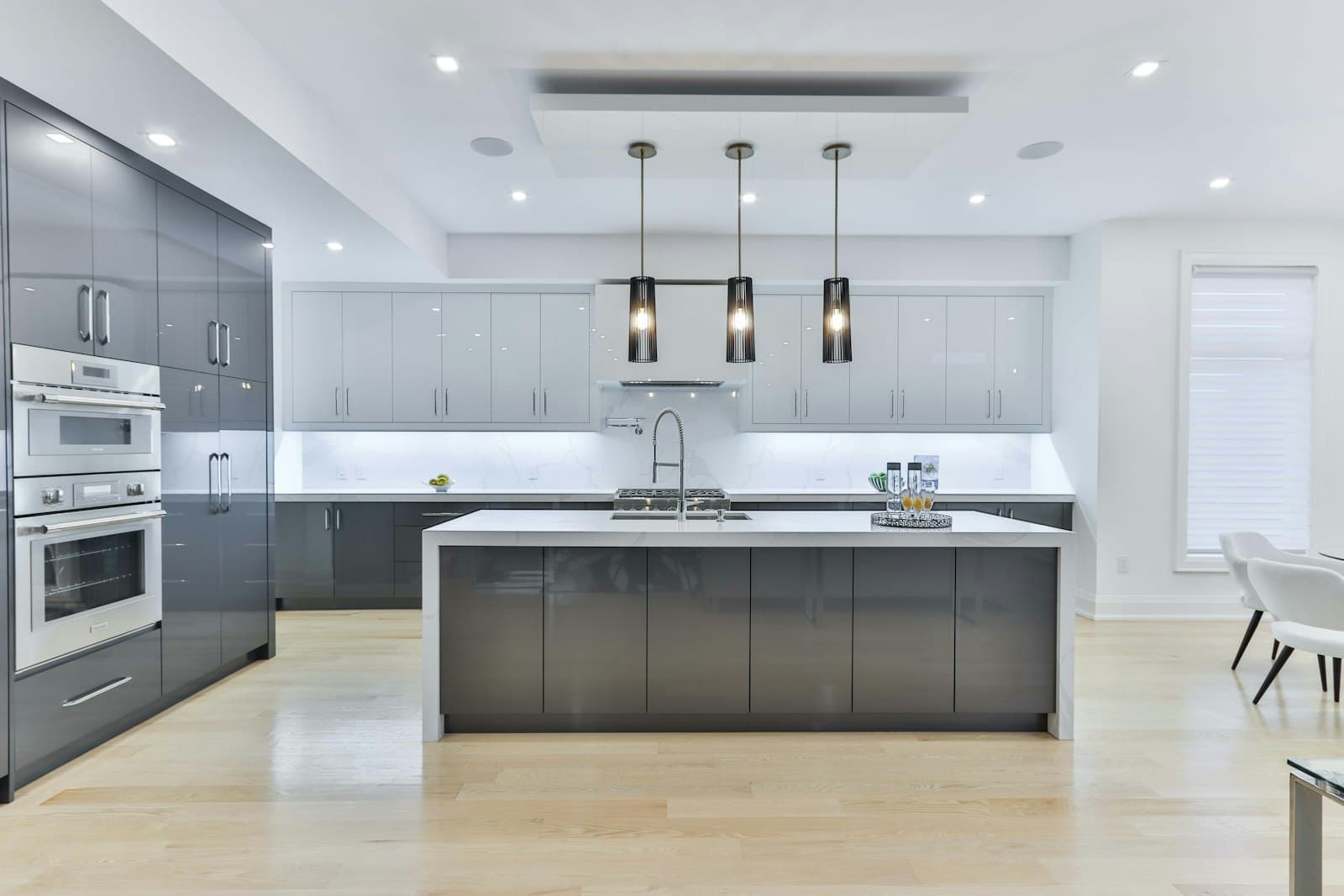Modern renovated kitchen with a large island and grey cabinetry
